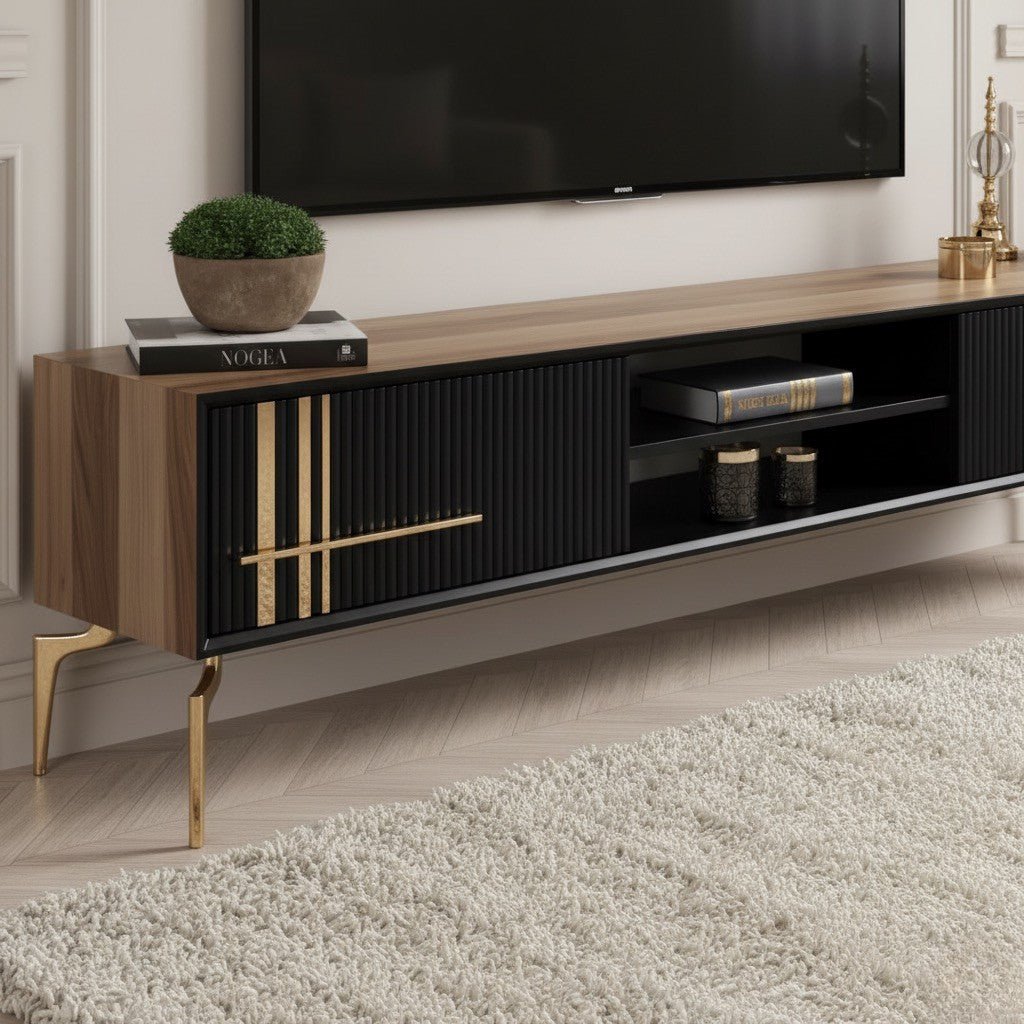 Lincoln Wooden Tv Unit Black 200cm. Close-up detail of the black and walnut media console, highlighting the vertical ribbed texture on the cabinet fronts, the gold linear accent detailing and horizontal handle, and the glossy gold angled metal legs.
