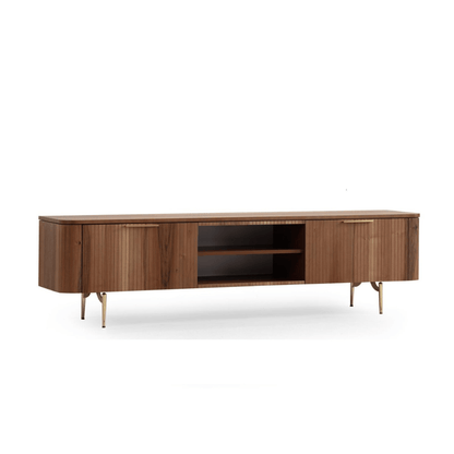 Asta Wooden Tv Unit 200cm. Front view of the wide, contemporary wood media console, featuring two large storage cabinets with vertical slatted texture and small gold handles, surrounding open central shelving, supported by short gold angled metal legs.