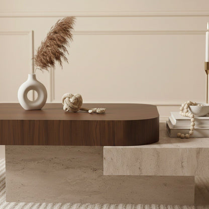 Wooden coffee table with decorative items in a room with beige walls.