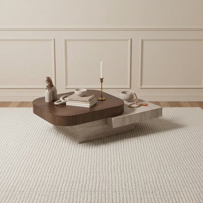 Modern coffee table with decorative items in a room with wainscoting.