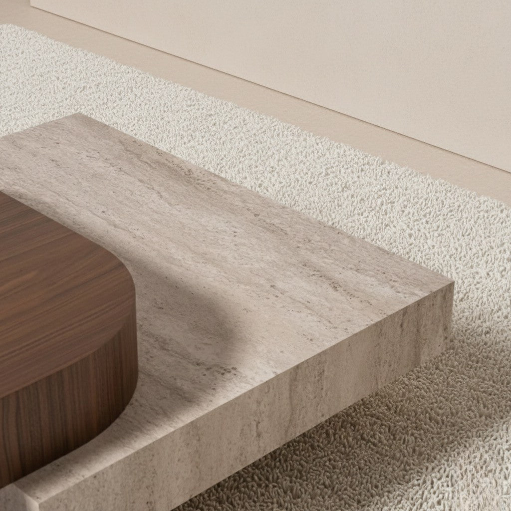 Close-up of a travertine coffee table with a wooden coffee table on a textured surface.