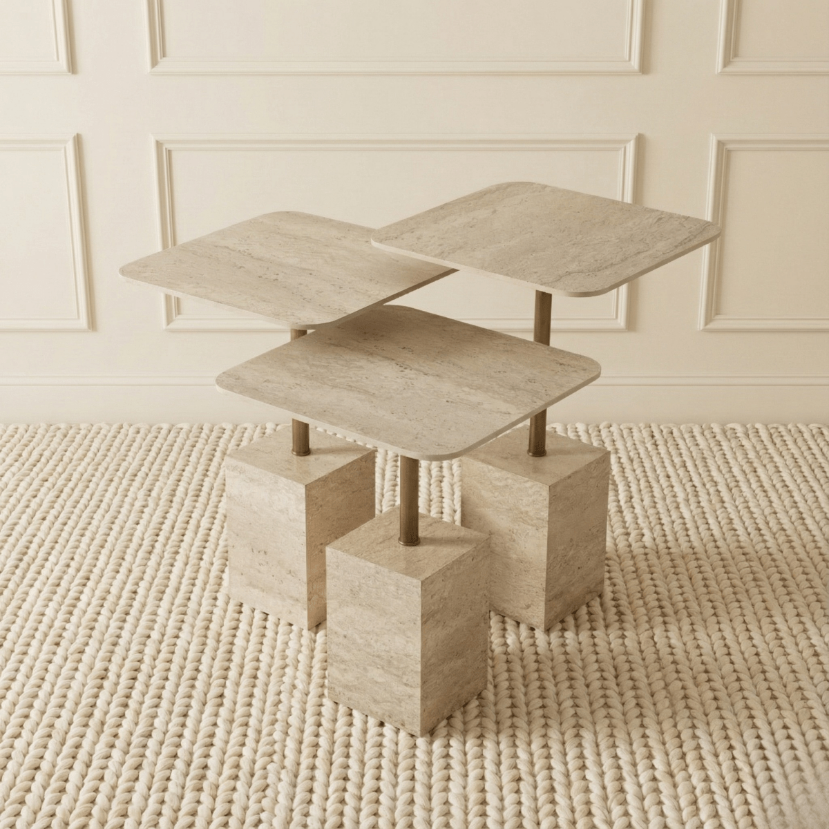 Modern travertine nesting side tables with geometric design on a textured rug