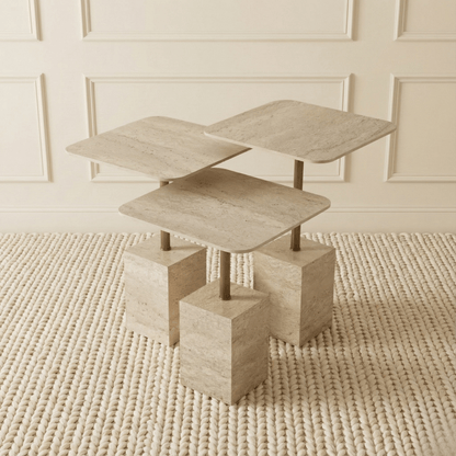 Modern travertine nesting side tables with geometric design on a textured rug