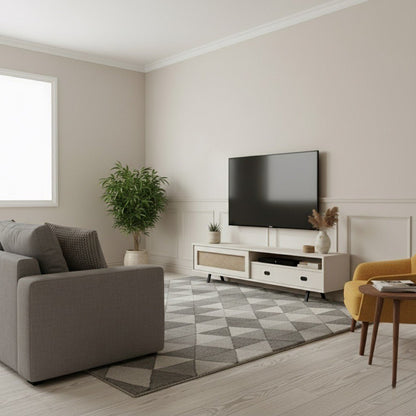 Finn Tv Unit Cream 200cm. Front view of the wide, low-profile cream media console, featuring a printed woven cane-front sliding cabinet door on the left, an open shelf, and two drawers with black oval pull handles on the right, supported by black angled metal legs beneath a wall-mounted TV.