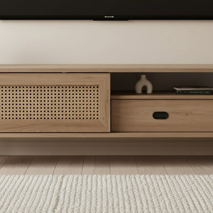 Finn Tv Unit Oak 200cm. Close-up detail of the light oak media console, showing the faux woven cane-front sliding cabinet door on the left and the storage drawer with a recessed black oval pull handle and open shelf on the right.