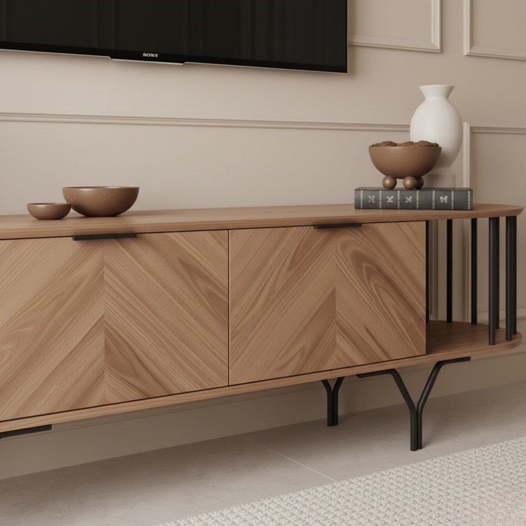 Foster TV Unit 200cm. Close-up of the right side of the light color wood TV unit, highlighting the two central cabinet doors with their detailed chevron wood grain pattern and discreet black recessed handles. The unit also features an open shelf section with decorative black vertical metal bars, showcasing its modern design and storage capabilities.