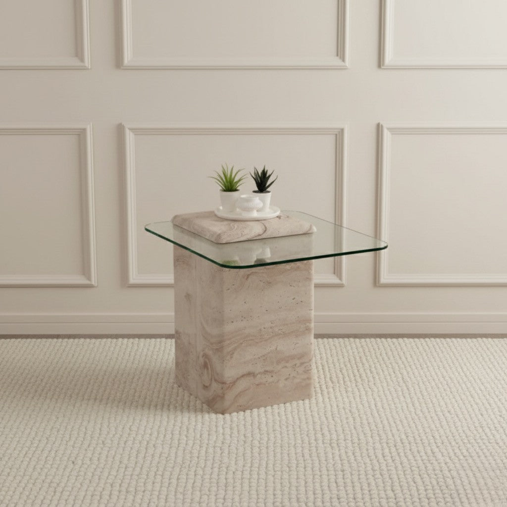 Glass table with a travertine base in a room with paneled walls.