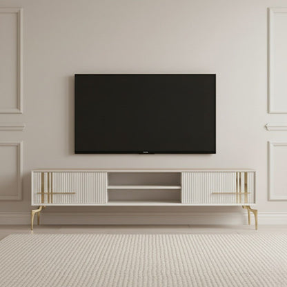 Lincoln Wooden Tv Unit cream 200cm. Elegant, wide cream media console featuring two ribbed storage cabinets with vertical gold accents and gold handles, an open center shelf, a light wood top, and supported by angled gold metal legs beneath a wall-mounted TV.