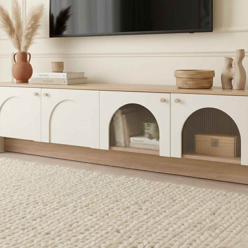 Modern living room with a wooden entertainment console and TV above.