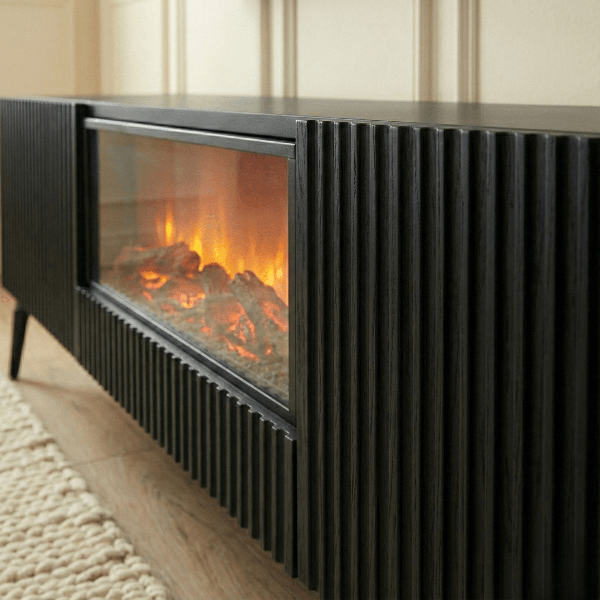 Modern black electric fireplace with flames inside