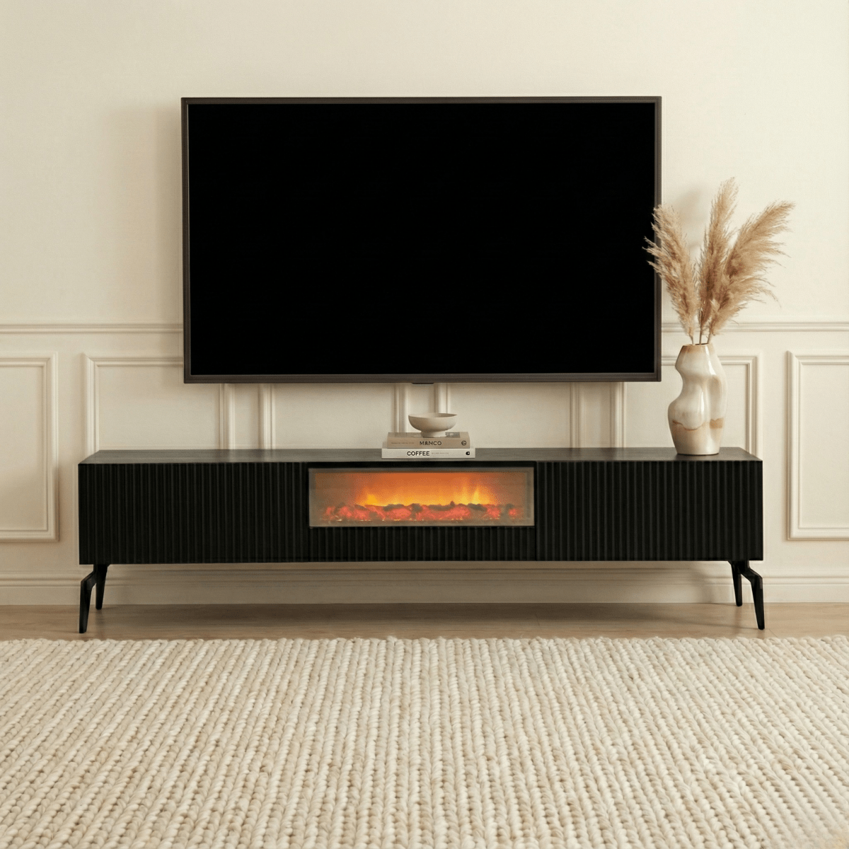 Modern living room with a television mounted on the wall above an electric fireplace.