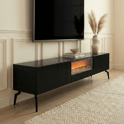 Black entertainment console with electric fireplace and TV above in a living room.