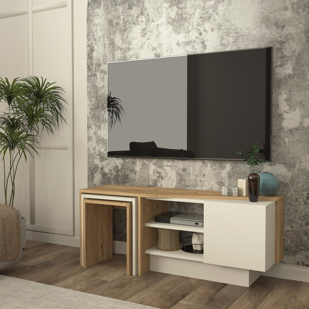 A modern TV stand console with a light oak wood top and white cabinet, mounted against a textured gray wall under a large wall mirror.