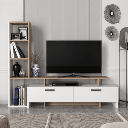 A modern TV stand and shelving unit in a styled living room. The white TV stand with light wood legs holds a black flat-screen TV and a DVD player, while a matching light wood open bookshelf stands to the left with books, frames, and decorative vases.
