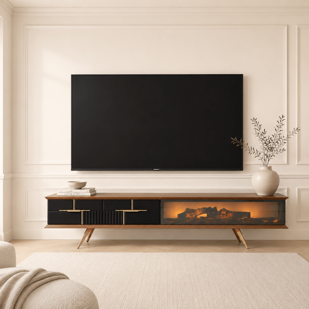 A modern TV stand console with a built-in fireplace display, shown in a styled living room setting below a wall-mounted television.