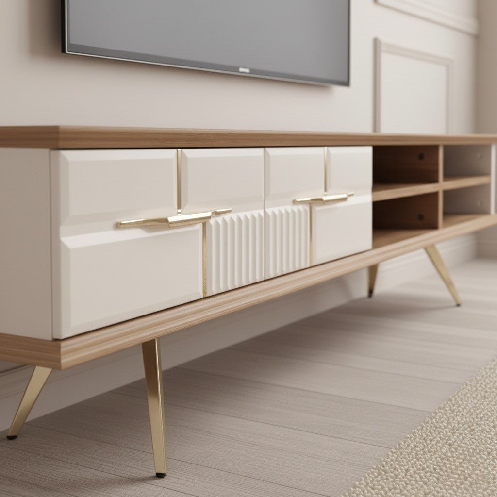 Tribe Wooden Tv Unit Cream 200cm. Close-up detail of the mid-century modern wood and cream media console, highlighting the four storage drawers with geometric edging, gold horizontal handles, a vertical ribbed texture accent, and the unit's gold angled metal legs.