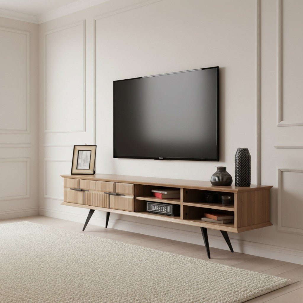 Tribe Wooden Tv Unit Walnut 200cm. Angled shot of the light walnut media console featuring two storage drawers with black handles (one smooth, one vertically ribbed texture) and four open cubbies for media storage, supported by black angled metal legs beneath a wall-mounted TV.