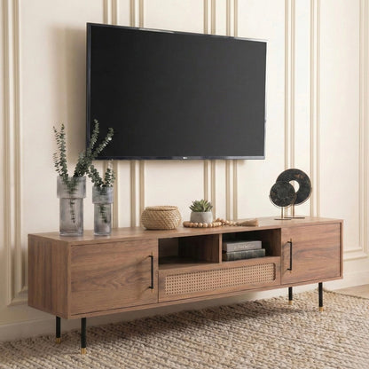 Wooden TV stand with a television mounted on a wall, featuring decorative items.