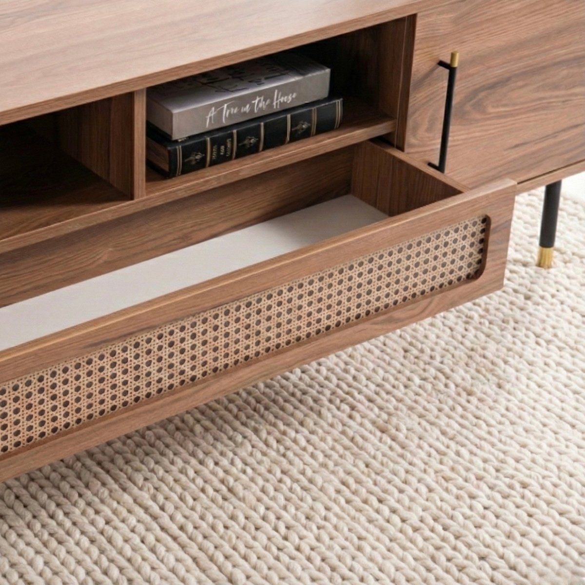 Wooden drawer with wicker interior on a textured floor