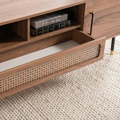Wooden drawer with wicker interior on a textured floor