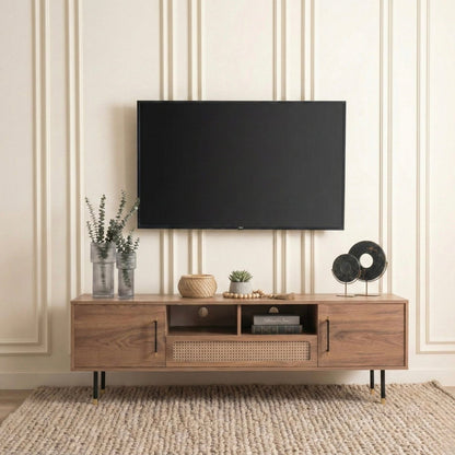 Wooden TV stand with a television mounted on a wall with decorative stripes.