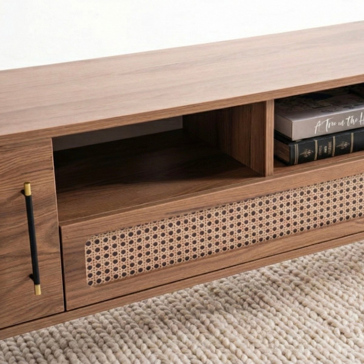 Wooden entertainment console with open shelf and closed cabinet on a textured surface